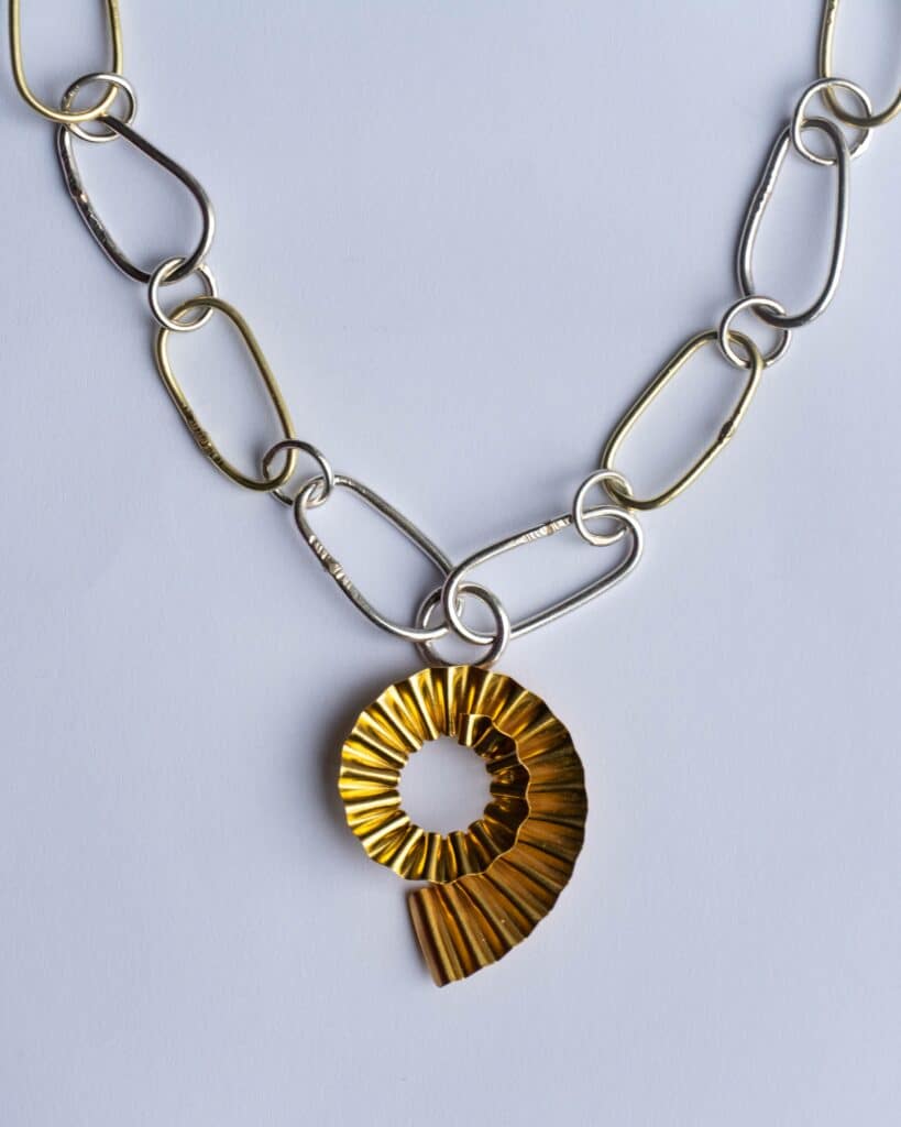 18 carat gold and silver ammonite necklace